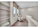 Cozy sitting area offers natural light, built-in shelving, and beautiful views at 2449 Daks Loden Ct, Henderson, NV 89044
