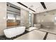 Modern bathroom featuring a soaking tub, walk-in shower, and contemporary finishes at 25 Canyon Bay Dr, Henderson, NV 89011