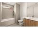 This bathroom has a shower and a tub, toilet and modern vanity with wood cabinets at 25 Canyon Bay Dr, Henderson, NV 89011