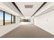 Bright, open bonus room with large windows and contemporary lighting at 25 Canyon Bay Dr, Henderson, NV 89011