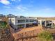 Aerial view of modern home with mountain views and luxury community at 25 Canyon Bay Dr, Henderson, NV 89011