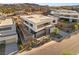 Modern home featuring sleek lines, a flat roof and professional landscaping at 25 Canyon Bay Dr, Henderson, NV 89011