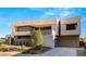 Contemporary two-story home with a two-car garage and modern architectural style at 25 Canyon Bay Dr, Henderson, NV 89011