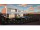 Modern home featuring a pool, desert landscaping, integrated outdoor lighting, and an outdoor living space at 25 Canyon Bay Dr, Henderson, NV 89011