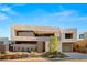A modern designed two-story home featuring clean lines and a well-manicured desert landscape at 25 Canyon Bay Dr, Henderson, NV 89011