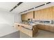 Bright modern kitchen with custom wood cabinets, quartz countertops, and a chef's island at 25 Canyon Bay Dr, Henderson, NV 89011