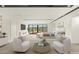 Virtually staged bedroom with seating area, fireplace, and mountain views at 25 Canyon Bay Dr, Henderson, NV 89011