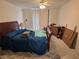 Bedroom with a ceiling fan, bed, and dresser, perfect for a relaxing retreat at 2544 Malabar Ave, Las Vegas, NV 89121