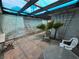 Enclosed courtyard with light and chairs, creating a cozy and inviting outdoor retreat at 2544 Malabar Ave, Las Vegas, NV 89121