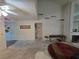 Open living room featuring a fireplace, ceiling fan and large windows for natural light at 2544 Malabar Ave, Las Vegas, NV 89121