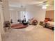 Spacious living room featuring large windows, ceiling fans, neutral walls and a cozy seating area at 2544 Malabar Ave, Las Vegas, NV 89121