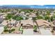 Expansive aerial view of a single-Gathering home showcasing desert landscaping and a two-car garage at 2558 Wiltshire Ave, Henderson, NV 89052