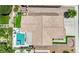 Overhead shot of a single-Gathering home featuring a refreshing pool and well-manicured landscaping at 2558 Wiltshire Ave, Henderson, NV 89052
