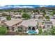 Single-Gathering home featuring a sparkling pool and covered patio within a desert community at 2558 Wiltshire Ave, Henderson, NV 89052