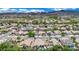 Community aerial view showcasing homes with desert landscaping, pools, and neighborhood streets at 2558 Wiltshire Ave, Henderson, NV 89052