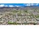 Scenic aerial view of a neighborhood with homes nestled against a backdrop of desert mountains at 2558 Wiltshire Ave, Henderson, NV 89052