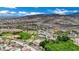 Panoramic aerial shot of a community, showing recreational fields, tennis courts, and beautiful mountain views at 2558 Wiltshire Ave, Henderson, NV 89052