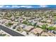 An aerial view shows the neighborhood's houses, trees, solar panels, and street layout at 2558 Wiltshire Ave, Henderson, NV 89052