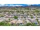 Aerial view shows desert homes, desert landscaping, and the home's backyard pool at 2558 Wiltshire Ave, Henderson, NV 89052