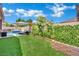 Beautiful backyard features a lush lawn, inviting pool, and sunbed for relaxation and outdoor enjoyment at 2558 Wiltshire Ave, Henderson, NV 89052