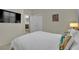 Comfortable bedroom featuring a television, closet, and a glimpse into an adjacent room at 2558 Wiltshire Ave, Henderson, NV 89052