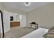 This bedroom offers a serene retreat with access to an adjacent area with wood cabinets at 2558 Wiltshire Ave, Henderson, NV 89052