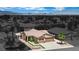 A charming single-story home features desert landscaping and a two-car garage in a monochromatic neighborhood at 2558 Wiltshire Ave, Henderson, NV 89052