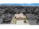 A neutral-toned one-story home features desert landscaping and a two-car garage in a clean, monochromatic community at 2558 Wiltshire Ave, Henderson, NV 89052