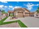 Beautiful home featuring a two-car garage, manicured lawn, and a welcoming front entrance at 2558 Wiltshire Ave, Henderson, NV 89052
