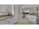 Open kitchen flowing to the living area and outdoor space with stainless appliances at 2558 Wiltshire Ave, Henderson, NV 89052