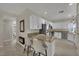 Modern kitchen featuring granite countertops, stainless steel appliances, and bar seating at 2558 Wiltshire Ave, Henderson, NV 89052