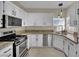 Functional kitchen featuring granite counters, stainless steel appliances, and ample cabinet space at 2558 Wiltshire Ave, Henderson, NV 89052