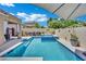 Relaxing backyard pool with spa and lounge area, perfect for soaking up the sun and enjoying outdoor living at 2558 Wiltshire Ave, Henderson, NV 89052