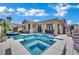 Inviting backyard pool and spa with lounge area, perfect for relaxation and entertaining with sunny skies above at 2558 Wiltshire Ave, Henderson, NV 89052