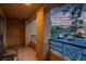 Private balcony features tile flooring and a view of the community parking and the Las Vegas Strip at 270 E Flamingo Rd # 131, Las Vegas, NV 89169