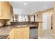 Kitchen with stainless steel dishwasher and granite countertops open to living area at 270 E Flamingo Rd # 131, Las Vegas, NV 89169