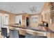 Kitchen featuring granite countertops with breakfast bar seating two and open to living space at 270 E Flamingo Rd # 131, Las Vegas, NV 89169