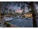 View of the well-maintained community parking area with landscaped greenery and palm trees at 270 E Flamingo Rd # 131, Las Vegas, NV 89169