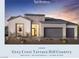 Modern home with stone accents, gray garage doors, and professional landscaping at 300 Talon Heights St, Las Vegas, NV 89138