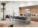 Bright, modern kitchen with an island, breakfast bar, stainless steel appliances, and hardwood floors at 300 Talon Heights St, Las Vegas, NV 89138