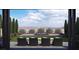 This backyard features a built in seating area with a fireplace and manicured lawn, perfect for relaxing outdoors at 301 Talon Heights St, Las Vegas, NV 89138