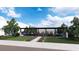 This large backyard features a covered patio, built-in BBQ, seating, and landscaping, perfect for outdoor enjoyment at 301 Talon Heights St, Las Vegas, NV 89138