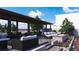 This covered patio showcases an outdoor seating area and outdoor fireplace, perfect for entertaining and relaxing at 301 Talon Heights St, Las Vegas, NV 89138