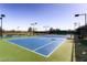 Well maintained tennis courts with green and blue surfaces, surrounded by fencing at 3124 Kookaburra Way, North Las Vegas, NV 89084