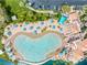 Aerial view of the community pool with sandy beach, palm trees and umbrellas at 3151 Soaring Gulls Dr # 1062, Las Vegas, NV 89128