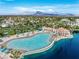 Aerial view of the community pool and beach with a mountain view in the background at 3151 Soaring Gulls Dr # 1062, Las Vegas, NV 89128