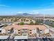Wide aerial shot of a condo community with views of the mountains and city at 3151 Soaring Gulls Dr # 1062, Las Vegas, NV 89128