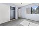 This cozy bedroom features neutral gray carpet, a window with natural light, and a spacious closet for storage at 3151 Soaring Gulls Dr # 1062, Las Vegas, NV 89128