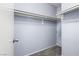 Empty walk-in closet with white shelving, trim, and neutral colored carpet at 3151 Soaring Gulls Dr # 1062, Las Vegas, NV 89128