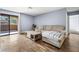 Cozy living room with wood flooring, a modern sofa, and access to a balcony at 3151 Soaring Gulls Dr # 1062, Las Vegas, NV 89128
